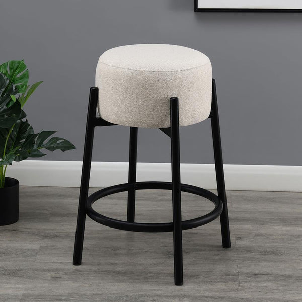  slide this pair of contemporary stools up to a bar or kitchen breakfast area. Designed with a thick pouf-like cushion wrapped in a white upholstery