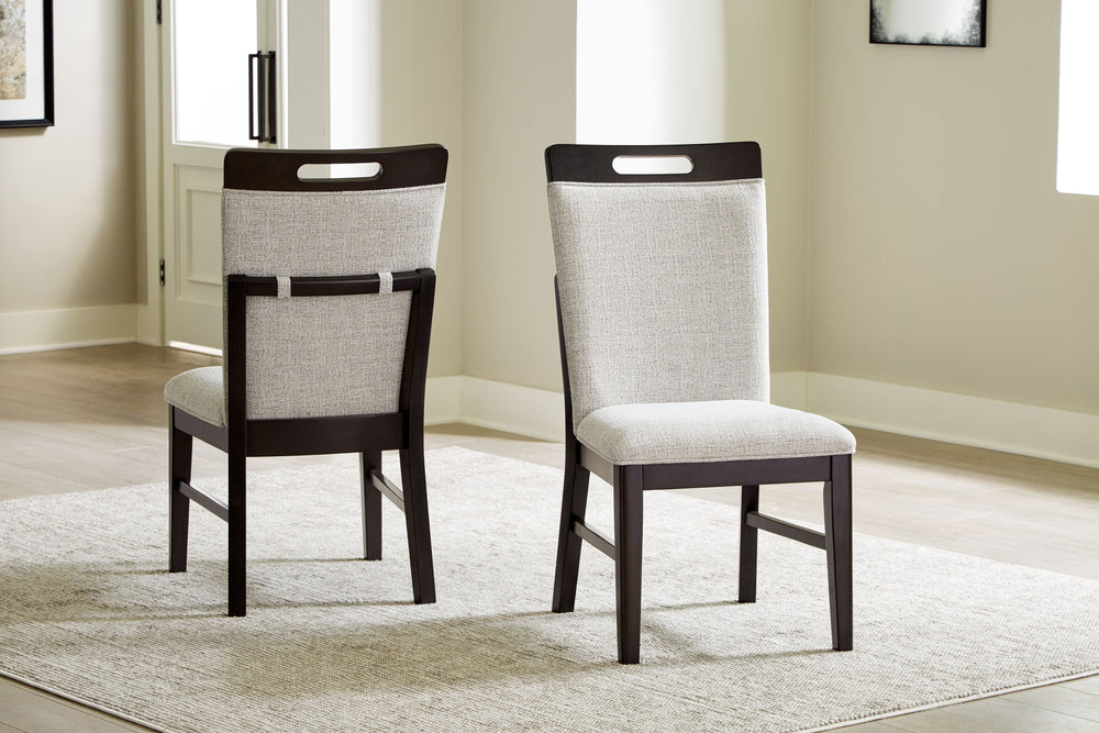 This dining chair is the perfect blend of casual and contemporary styles. Its easy-clean Next-Gen Nuvellaâ„¢ upholstery remains vibrant and resists stains, while a fun and functional peek-a-boo handle keeps it relevant and on trend. Incorporating high sty