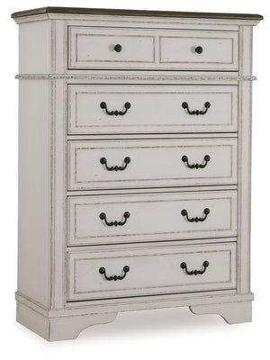 Traditional design. Casual appeal. You can have it all with this chest of drawers. A relaxed two-tone aesthetic merges with ornate profiled drawer fronts and pilasters to give the distinctive piece an allure all its own. Expansive drawers with quality dov