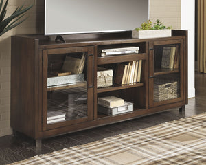  this XL TV stand with fireplace insert clearly steals the show. Its blend of acacia veneer and wood is beautified with an oiled walnut-tone finish for a highly contemporary aesthetic with grainy