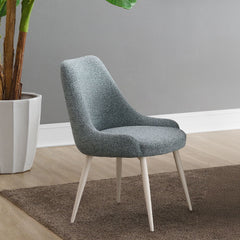 Introduce our Laela dining set, featuring an oval wooden top and sturdy double pedestals, combines elegance with modern design. The fixed table top provides a stable surface for your dining needs, while the upholstered side chairs offer comfort and style.