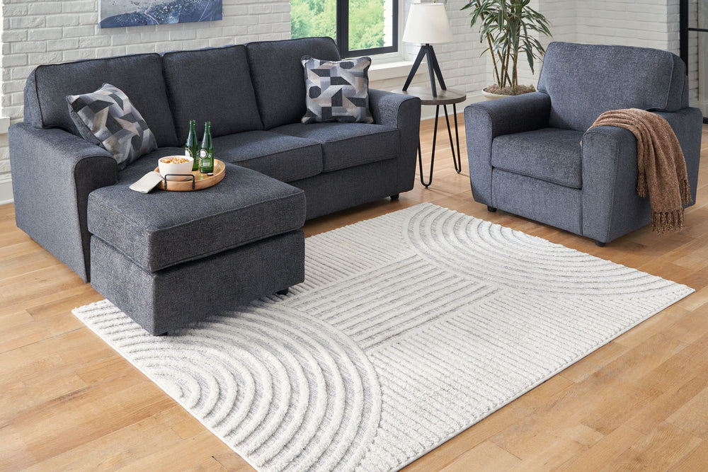 A great area rug should be the intersection of style and comfort. This rug accomplishes just that. Its beautiful geometric design combines lines and half circles to create varied high-low textures. Adding contemporary flair to any room, this rug perfectly