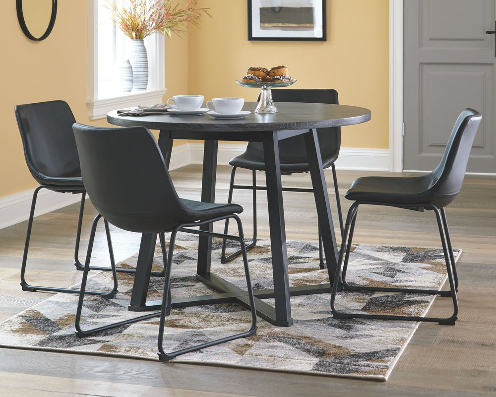 With its distinctive X-shaped base, this round dining table serves up a fresh twist on mid-century inspired style. Its mixed material and two-tone aesthetic are beautifully in balance. Sporting a dramatic charcoal gray hue, the top is crafted of durable M