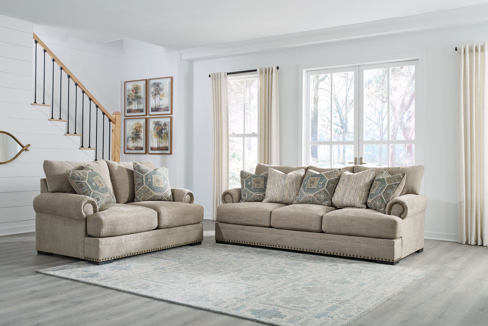 Looking to enhance your home-'s visual appeal? This sofa and loveseat set offers sophisticated design, comfort and elegance with tonal colors, roll arms and nailhead accents. Enjoy optimal coziness as you nestle into luxurious soft upholstery and feather-