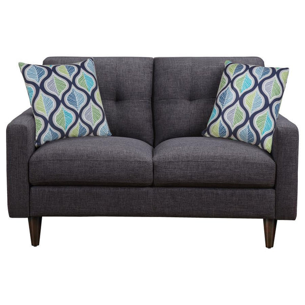  anchored by a queen bed with a stunning tufted headboard. The bed-'s luxurious design sets a tone of sophistication