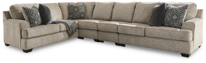 Whether your vision is clean and contemporary or cozy modern farmhouse, this sectional in a stone-tone neutral upholstery has the corner on style. Merging ultimate comfort with striking good looks, this chic sectional includes coordinating accent pillows 