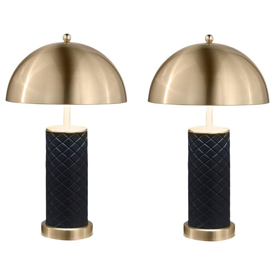 Bold and sculptural, this matching set of dome table lamps blends quilted texture with a sleek metallic finish. The rounded dome shades cast warm downward light, perfectly balanced atop cylindrical black bases wrapped in a quilted pattern for added depth.