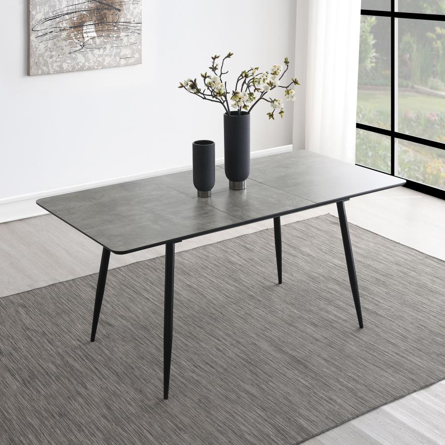 This modern dining table features a sleek grey tabletop finish paired with black tapered legs, creating a sophisticated two-tone design. The table includes a 15. 75-inch butterfly leaf, extending its length from 47. 25 to 63 inches, perfect for accommodat
