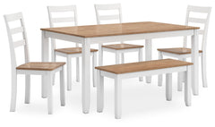 Complement your homeâ€™s simply relaxed sensibility with this dining table, chairs and bench. A crisp white hue offers a chic contrast to the natural wood tone, for a neutral look that vibes with a variety of aesthetics. Whether you-'re sipping your morni