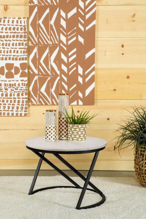 this round accent table features a polished white marble top