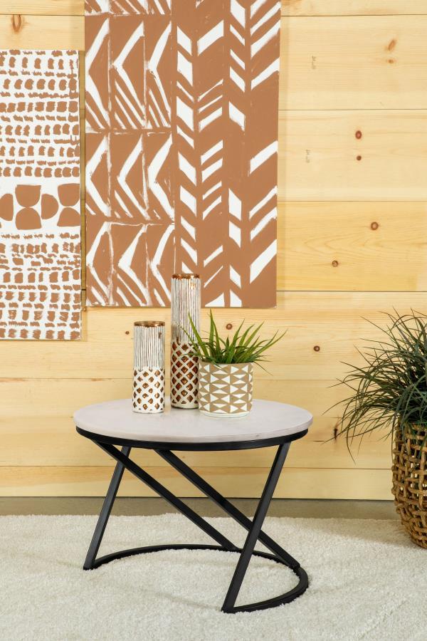  this round accent table features a polished white marble top