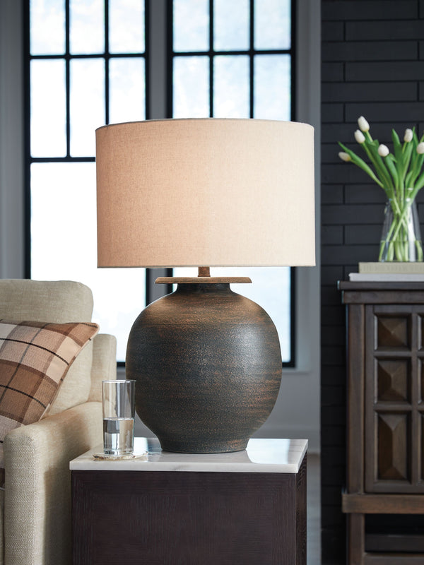  earthy elegance of this lamp. Outfitted in an antiqued brown hue