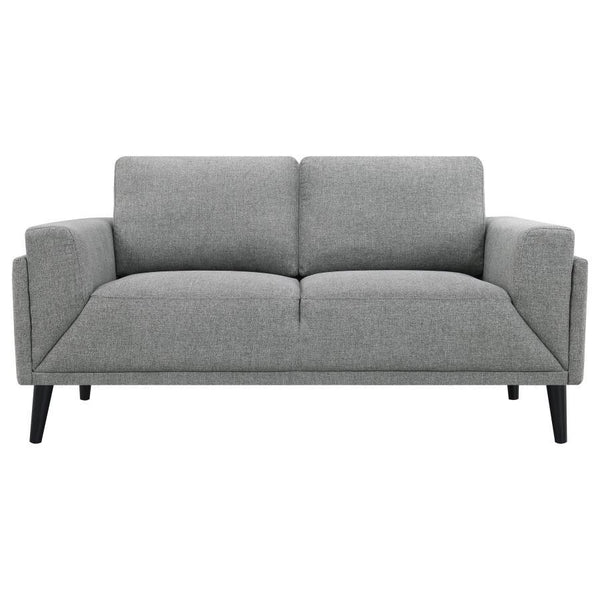 its streamlined silhouette is highlighted by meticulous topstitch details and track arms complemented by mitered front accents. Prio