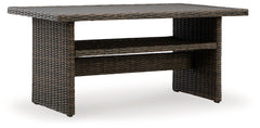 Relax. Refresh. Refine your outdoor oasis. This multi-use table masters high style with beautiful simplicity. A handy shelf for storage, warmly neutral hues and all-weather durability invite everyday use. From chic gatherings with guests to dinner by the 