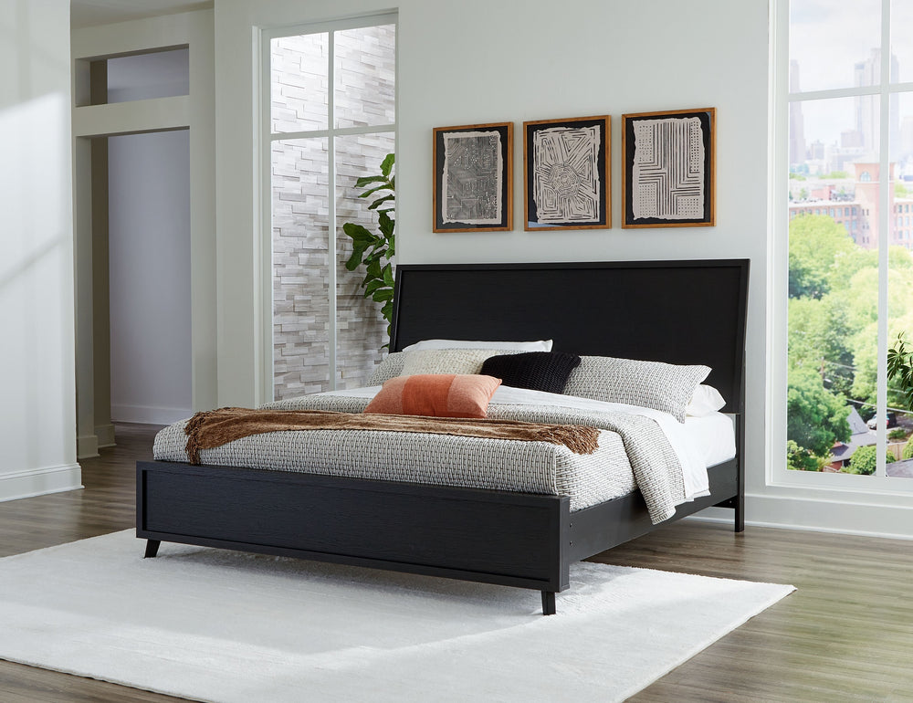 Sophisticated style for the savvy shopper. This panel bed prioritizes affordable, on-trend design. Its subtle replicated texture recalls the natural beauty of wood, highlighting the clean-lined styling. And a matte black finish savvily suits different app