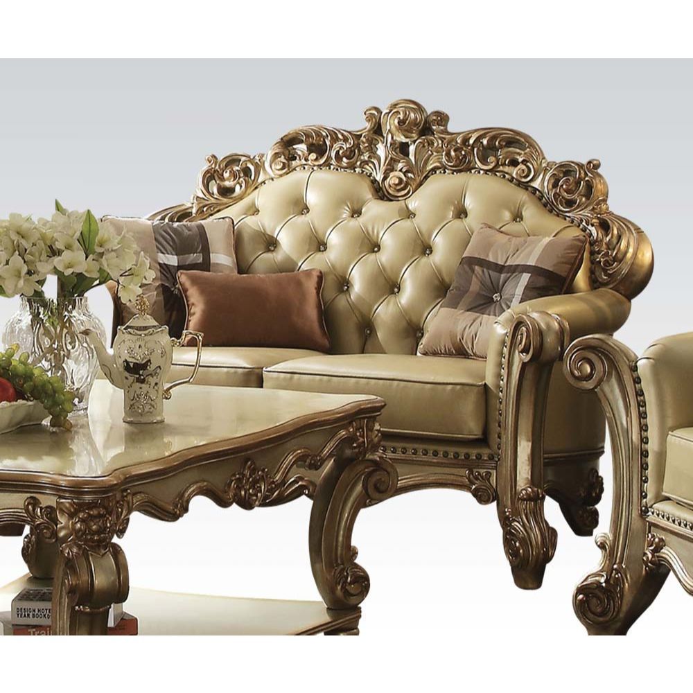 Tracing back to the classical Baroque era, expressed with intent and conviction, our new interpretation of Vendome is donned. Vendome loveseat-'s faux leather upholstery is grand and classy with crystal like button tufting on the back in a crackled gold p