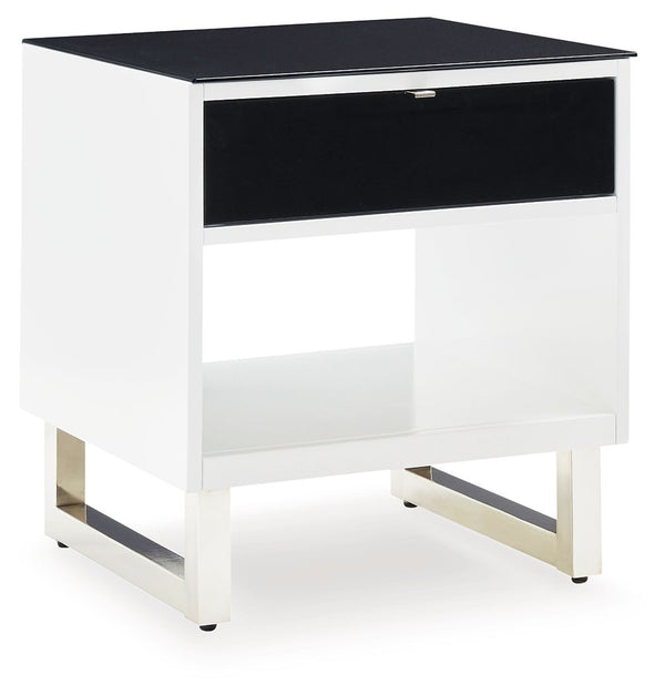 Combining a high-gloss white finish with a black glass tabletop, the Gardoni end table proves opposites really do attract. It-'s the perfect blend of modern style and functionality, with a spacious drawer and open cubby for keeping media needs close at ha