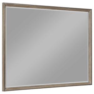 This framed dresser mirror adds a touch of modern sophistication to your bedroom. The Taupe oak finish complements a variety of decor styles, providing a neutral yet stylish accent. Its clean-lined frame echoes the mitered trim of the dresser, creating a 