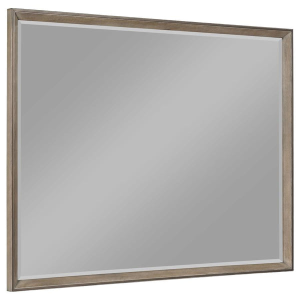 This framed dresser mirror adds a touch of modern sophistication to your bedroom. The Taupe oak finish complements a variety of decor styles, providing a neutral yet stylish accent. Its clean-lined frame echoes the mitered trim of the dresser, creating a 