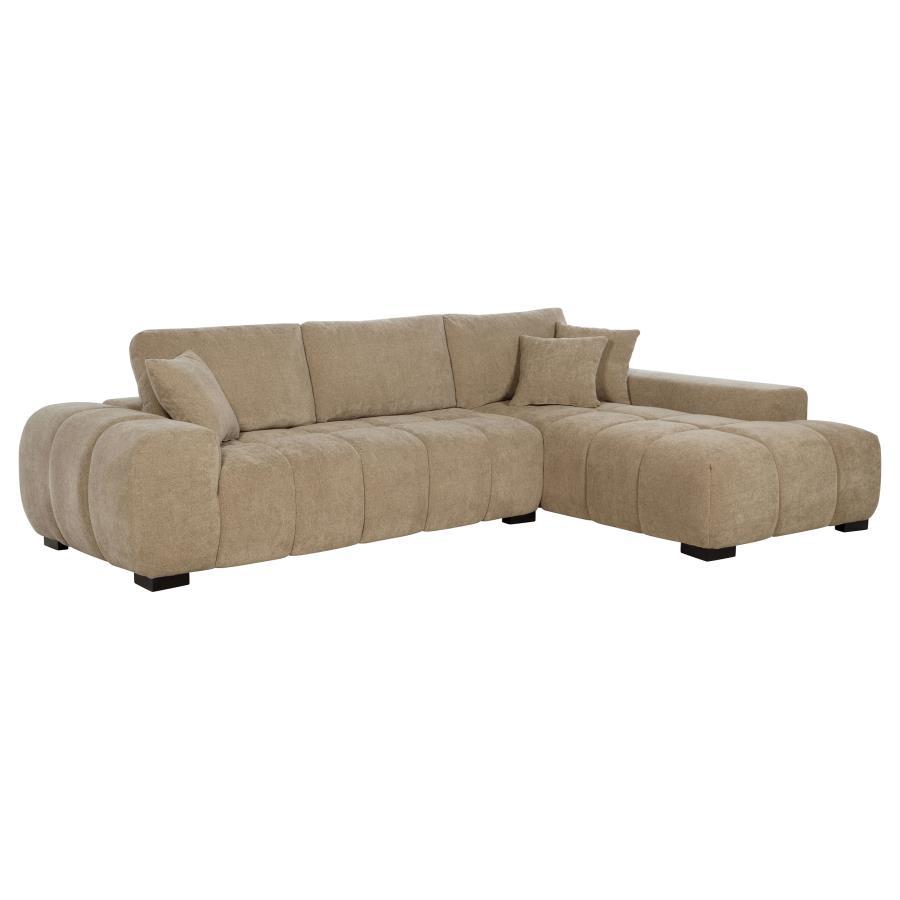 Embrace comfort and timeless style with this mid-century inspired sectional sofa. Designed for relaxed lounging, it showcases wide, rounded arms and plush waterfall seat cushions adorned with subtle grid tufting. Soft, neutral upholstery envelops a sturdy