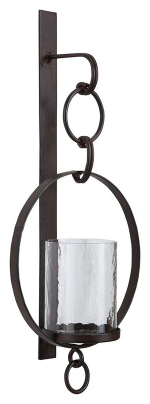 Hang out in style. Bring warmth and flair to an overlooked space with this wall sconce and candle holder. Dark bronze-tone metal and clear glass make a striking combination. Aligned or staggered, theyâ€™re even more beautiful when paired.<br><br><b>Additi