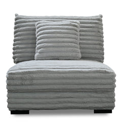 The Embrace Armless Chair with 1 Accent Pillow in gray offers a perfect blend of comfort and style, enhancing any living space. Upholstered in 100% gray polyester fabric with a fluffy, blanket-like texture, this chair is designed for ultimate relaxation. 