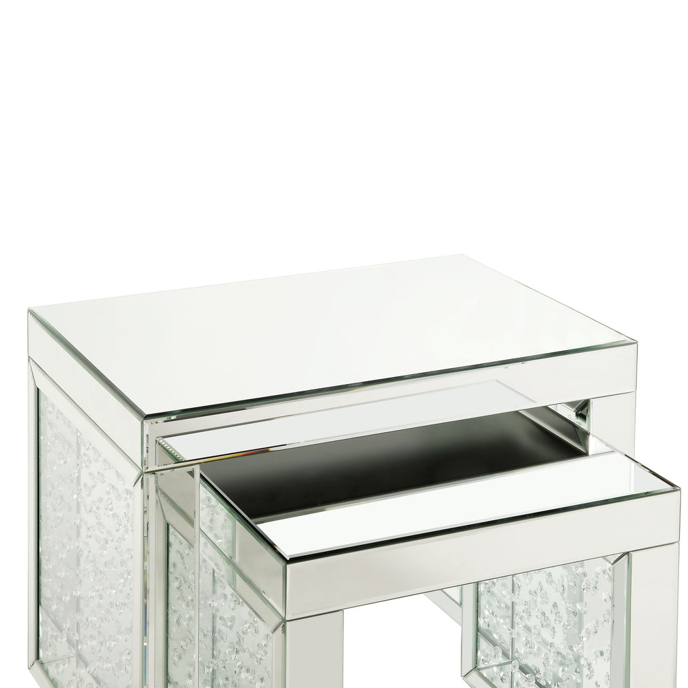 Go full glam with this Nysa Accent Table. The brilliant mirrored table top and glistening faux crystals inlay will reflect light and make any room appear larger. It provides a spacious table top ample enough for displaying various decor items while the sl
