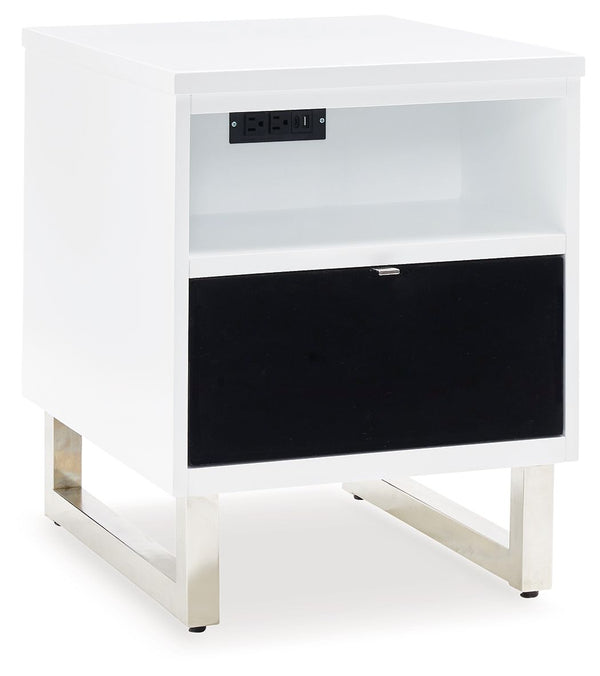 Combining a high-gloss white finish with a black drawer front, this chairside end table proves opposites really do attract. It-'s the perfect blend of modern style and functionality, with plenty of space for essentials and convenient USB charging. What a 