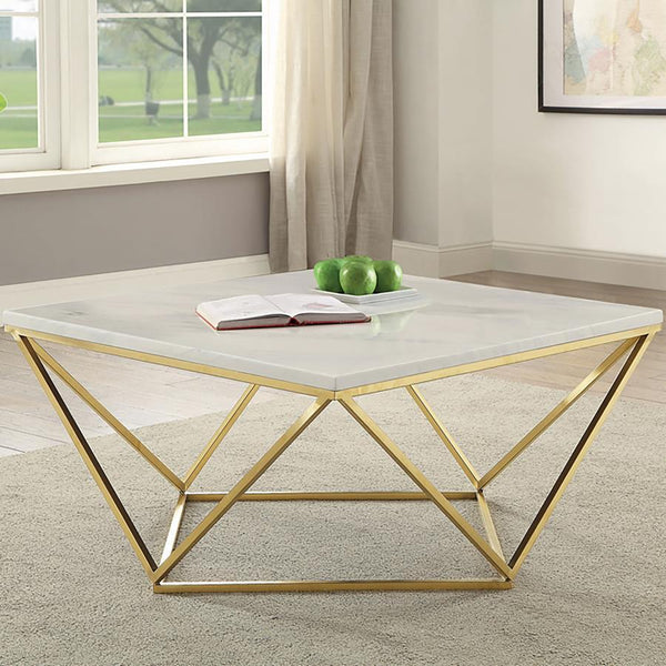  featuring a striking white faux marble top and a geometric metal frame in a luxurious gold electroplated finish. The openwork design provides an airy yet bold aesthetic