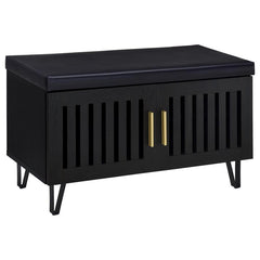This modern storage bench combines style and functionality, featuring a faux leather upholstered padded top for added versatility as a seating bench. The cabinetâ€™s two doors showcase a vertical slat design, enhancing its contemporary aesthetic while all