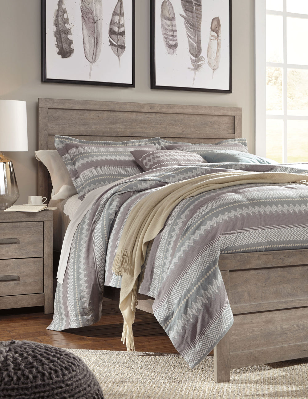 This queen panel bedâ€™s weathered driftwood finish evokes such an ethereal vibeâ€”exactly what you need for a serene bedroom suite. Chunky moulding creates a plank-like effect while clean lines make for a timeless look youâ€™ll love living with for years