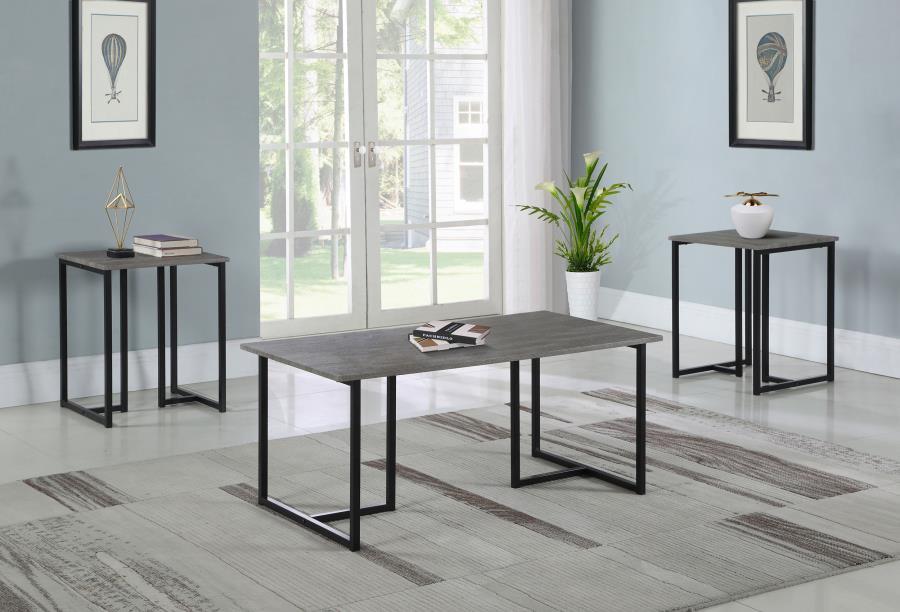This three-piece table set includes a coffee table and two matching end tables, perfect for compact spaces such as dorm rooms or studio apartments. Each piece features a grey wood-look top made from engineered wood and laminate veneer, offering a weathere