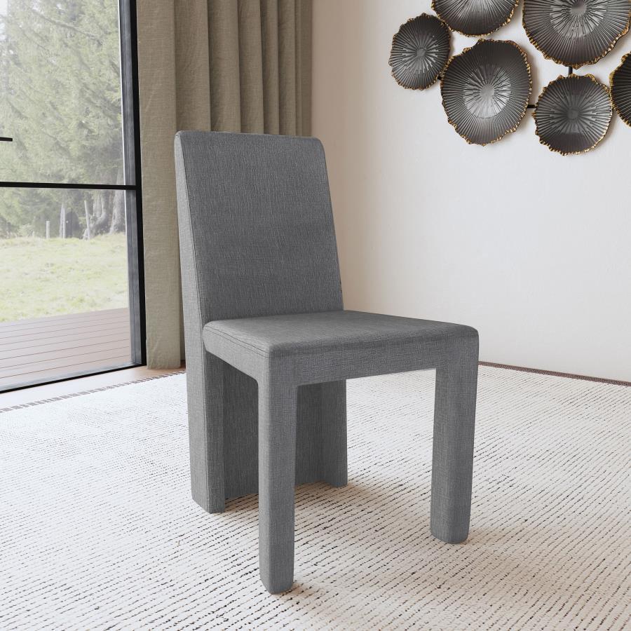 Put a chic spin your dining room table with a set of two modern side chairs. Each boasts a structured silhouette complete with a solid back that extends to the floor. Grey upholstery has a hint of sheen and is soft to the touch, creating an inviting profi