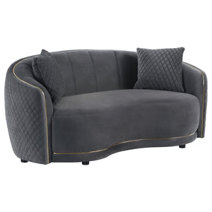 Bold contrast is achieved with the sophisticated gold trim featured on a modern loveseat. Designed to make a statement, the loveseat is a chic curved kidney silhouette with tight upholstery over its seat and a channel tufted back. The outer back and arm s