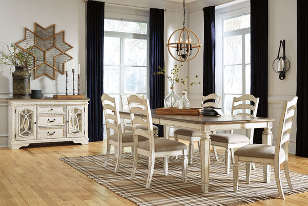 Traditional cottage design. Antiqued two-tone finish featuring chipped white with distressed wood finished tops. Tops feature Oak veneers, while the cases are made with birch veneers and hardwood solids. Framed drawer fronts and decorative fret laid over 