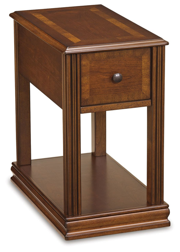 Inlay accents, fluted details and an oil-rubbed effect on the rich finish give this chairside end table such great character. The base shelf is just the place for a storage basket, decorative vase or other accent piece. Youâ€™ll love the deep drawer with 