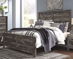 This king crossbuck panel bed is sure to win your heart with its daring designer take on modern rustic. The bedâ€™s crisp, clean and minimalist-chic profile is enriched with a striking replicated oak grain with thick plank styling and a weathered gray fin