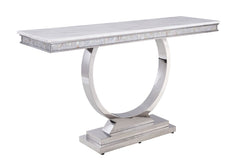 This beautiful contemporary work places a strong emphasis on lustrous materials that make a bold statement of personality and style. Shiny metal frame and white marble top complement each other perfectly, making the table more visually appealing. The Zand