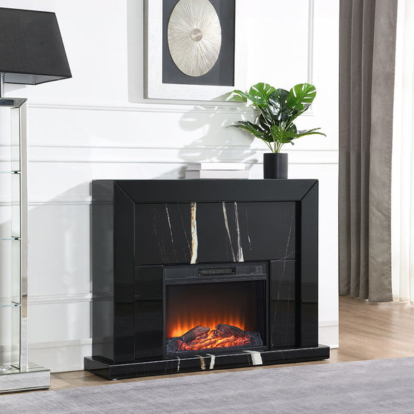 Creating a warm and inviting atmosphere with Drisana collection fireplace , it is a stunning blend of modern elegance and functionality. This rectangular fireplace features a sleek black mirrored surface accented with a sophisticated marble grain design. 