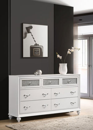  this modern dresser really stands out. The top drawer fronts are covered in sparkling acrylic panels for a stunning infusion of shine. Faceted crystal hardware takes elegance to the next level. Dainty turned feet add a classic elem