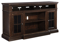 The beauty of this TV stand will immediately engage you. The slight breakfront shape is a rare find and an ideal fit among traditional and eclectic tastes. Soft black undertones highlight the warm finish. Multiple cubbies and glass-door enclosed shelves o