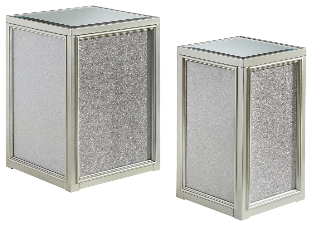 Reminiscent of Hollywood glamour of yesteryear, this set of nesting end tables interprets luxury in a decidedly modern way. A dazzling metallic silvertone finish and textured laminate panels for added luster enhance the star power, while the beveled inset