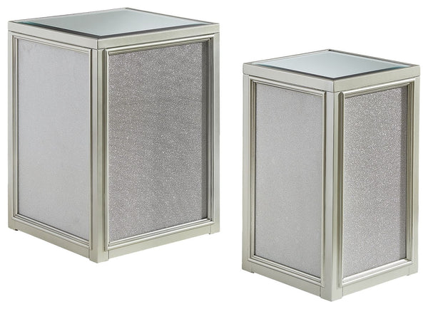 Reminiscent of Hollywood glamour of yesteryear, this set of nesting end tables interprets luxury in a decidedly modern way. A dazzling metallic silvertone finish and textured laminate panels for added luster enhance the star power, while the beveled inset