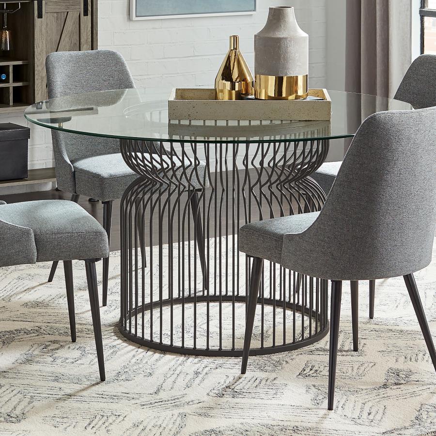 Add a bold foundation to your dining space with this cage-style dining table base in a gunmetal finish. Crafted from sleek metal rods, its sculptural hourglass shape offers both style and stability. The open design brings a light, airy feel, while the stu