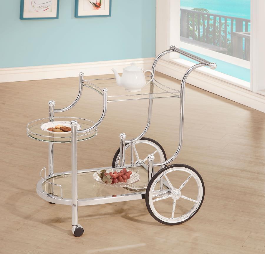 A fun traditional theme offers delightful charm that works perfectly in a traditional or transitional space. This serving cart mimics old fashioned style as it aids in delivering food and spirits to eager guests. Enjoy the captivating look of rustic wheel