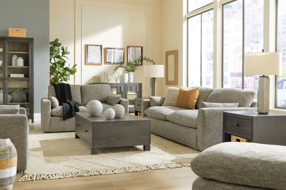 On the days when rest and relaxation seem out of reach, this oversized chair and ottoman provides a positively plush seating experience. Its feather-fiber blend cushions invite you to float away in cloud-like comfort. Striking granite-hued upholstery and 