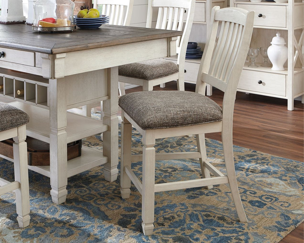 The beauty of this upholstered bar stool is something to savor. Designed to serve up comfort and flair, this rake-back bar stool entices with a cushioned seat covered in a heavy woven fabric that complements the antiqued white finish.<br><br><b>Additional