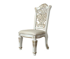 Commanding attention in any space, the impressive design of the Vendom double pedestal dining table will impress everyone. Adorned with classic elements including scrolls, curved shapes, and leaf molding accents to create an old-world charm. The antique p