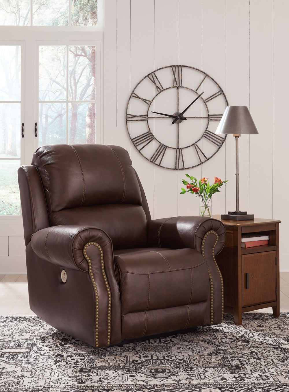 This is just where you should be when itâ€™s time to downshift for the day. Loaded with relaxation and streamlined for high style, this power recliner cradles you from head to toe. You can easily control its reclining function with the touch of a button, 
