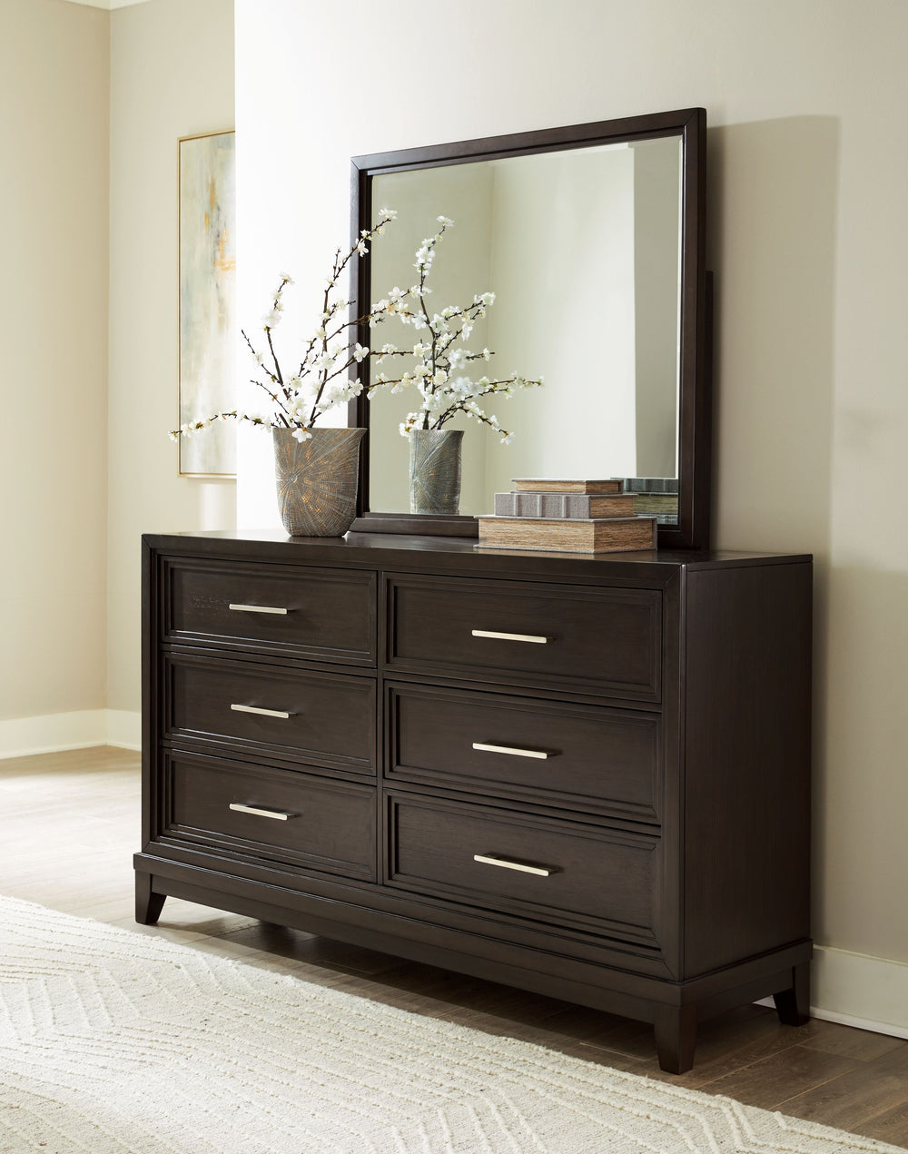 This dresser and mirror set combines modern and art deco styles for both traditional and contemporary arrangements. With elegant stepped moulded framing and ample storage, it adds dimension to your sanctuary while keeping your belongings organized and clu